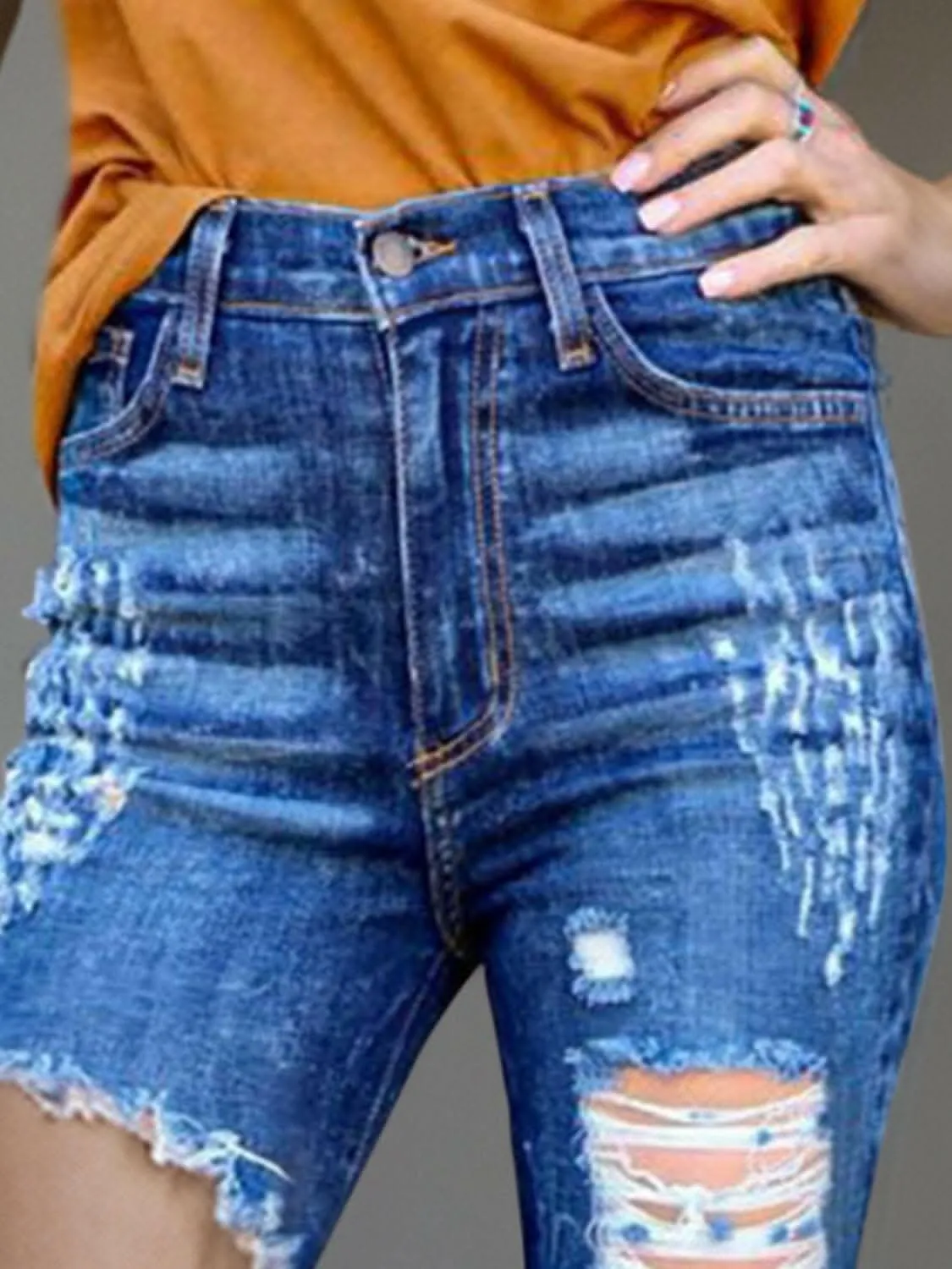 Edgy bootcut jeans with raw hem
